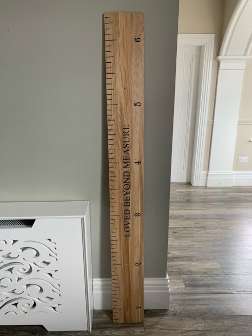height ruler with navy writing