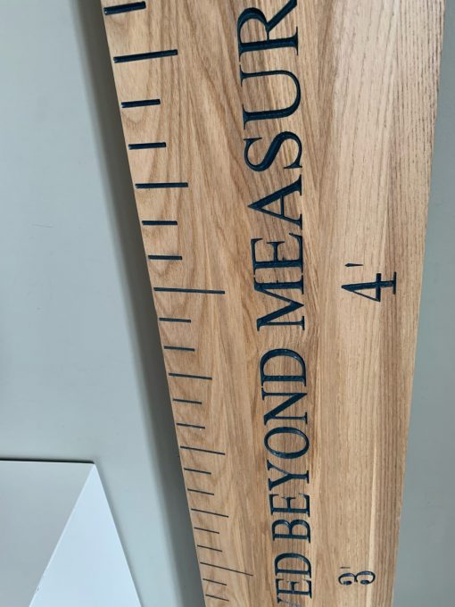 height ruler with navy writing